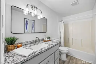 Renovated full bathroom conveniently located near the three main-floor bedrooms.