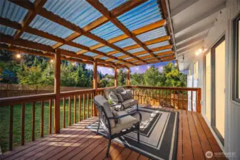 Updated covered deck provides a great space overlooking the yard.