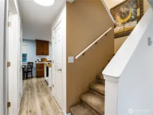 The open stair case to the bedrooms is located in the center of the home