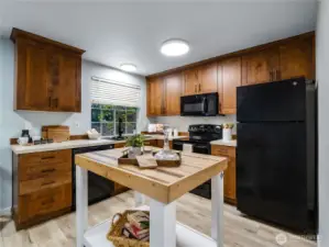 The dark cabinets in this kitchen make it a comfortable, friendly space to entertain