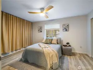 This large primary bedroom has space for a king sized bedroom set