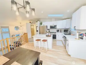 Kitchen and dining room overlook lower level living space