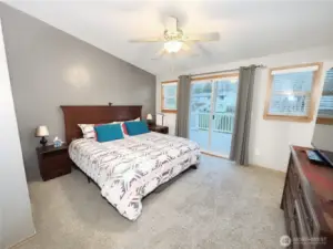 Large master with walk-in closet and access to the expansive upper deck