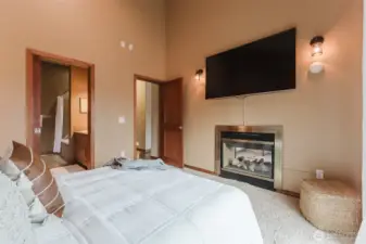 More vaulted ceilings in the primary bedroom give it so much height