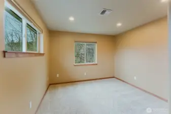 A secondary bedroom on the upper level of the home