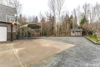 So much parking and an extra covered spot, plus a shed for storage