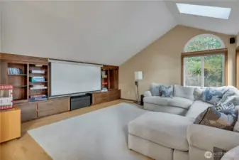 The family room boasts a projector media set up for fun movie nights