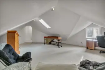 Bonus room accessed from primary closet or garage stairway