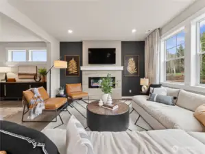 Light, bright family room with cozy fireplace. Photo is representational. Actual home is under construction and finishes and paint colors may vary. See site agent for details....