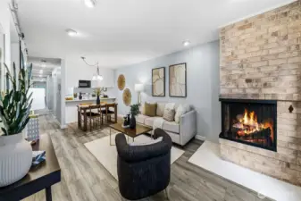 Another view of the full living area and cozy wood-burning fireplace.