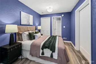 View from the bedroom towards the bathroom and 2 closets.