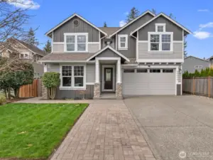 Beautifully updated two-story home in the desirable Wyndham Grove neighborhood in Lynnwood, featuring strong curb appeal, a covered entry, and a quiet cul-de-sac location with sidewalk-lined streets.