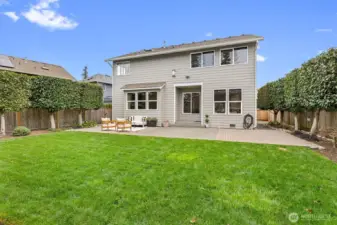 Lush, level lawn space ideal for outdoor activities, play, or simply enjoying the Pacific Northwest setting.