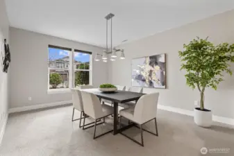 Versatile dining or flex space just off the entry, perfect for formal dining, home office use, or additional living area, enhanced by natural light and open flow.