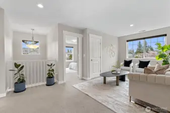 Versatile loft space with skylights and closet, ideal as a home office, reading nook, or potential fourth bedroom conversion.