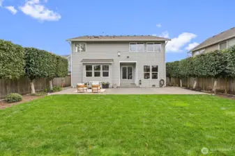 Professionally manicured landscaping enhances curb appeal and creates a polished, well-maintained exterior setting.