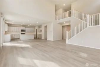 Impressive open-concept view showcasing the kitchen and open staircase. Photos are representative only and may display different color package and/or upgrades.