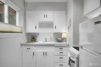 Small but functional, this kitchen provides newer appliances, sink, fresh paint and new flooring.