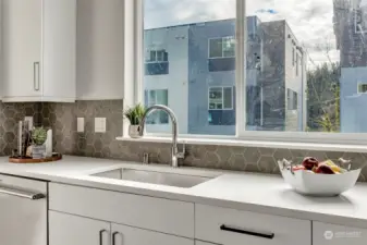 Big windows in kitchen for lots of natural light (all interior photos are from lot 24 model home - same floorplan)