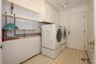 Utility room newer washer and dryer are included. Lower level hallway to the garage. garage.