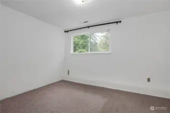 Third bedroom in the lower level with a 3/4 bathroom in hallway.