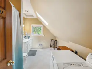 Full upstairs bath with laundry