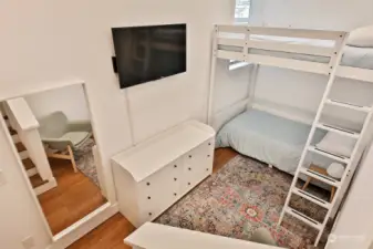 Seller remodeled during their ownership to make this 3rd bedroom (currently lives as a Bunk Room) from space that was previously a two car garage (now an oversized one car garage). A few steps from the hallway and you have this extra bedroom that could be an office, studio space, or workout room.