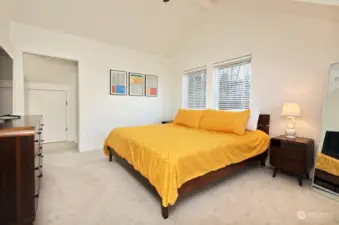This is your view upon entering.The windows & vaulted ceiling provide a great flow of light. The open hallway to left leads to the the bathroom (to the left), walk in closet (to the right) & storage area (straight ahead-storage room door visible through open doorway).