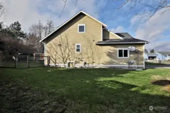 This is the side of your home that would welcome that upper level view deck. There is also space here to expand your fenced yard area if desired.