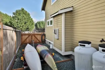 Fenced area with your propane tanks (leased) and is a great spot to park your kayaks or other outdoor toys.