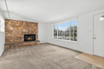 Lots of natural light and a wood burning fireplace.