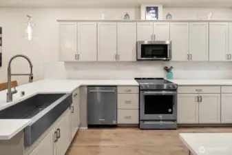 Open concept living/dining/kitchen- high ceilings, AC & tons of natural light