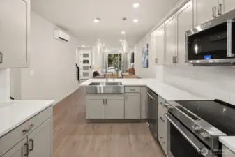 Open concept living/dining/kitchen- high ceilings, AC & tons of natural light