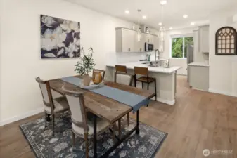 Open concept living/dining/kitchen- high ceilings, AC & tons of natural light