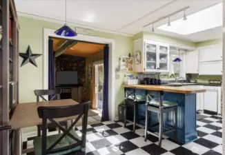 Kitchen & bistro dining area. Love the B&W tile!