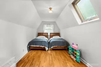 Featuring an attic-like feel on the second level, this versatile room can serve as an office, bedroom, or storage area