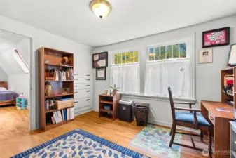 This space provides a seamless transition from the upstairs hallway to an additional bedroom.