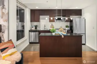 Lots of natural light in this modern kitchen. (photo from previous staging)