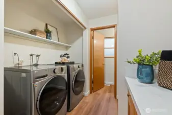 New quartz surfaces in the bathrooms and laundry room add a touch of luxury