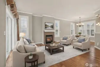 Virtually Staged Living Room with wood floors, slider to patio, and crown molding