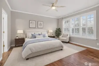 Virtually staged main floor primary bedroom