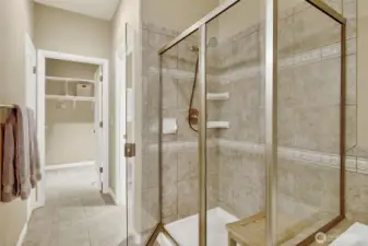 walk-in shower with brushed nickel finishes