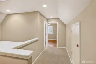 Second floor landing with attic storage access