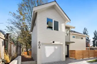 808 is a cottage with garage. The unique floor plan has a sunken living/dining/kitchen and each bedroom is on its own level.