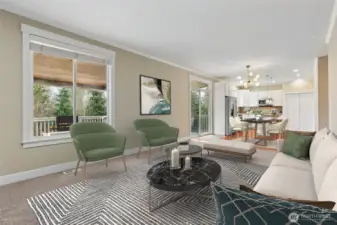 This angle shows how well the main living spaces connect. The family room feels open and comfortable, with a big window and blinds that let you control the light depending on the mood. The layout flows naturally back toward the kitchen, giving the whole space an easy, social feel. With direct access to the covered deck outside, it’s set up perfectly for gatherings that move from indoors to outdoors without missing a beat.  This closer look really shows the personality of the family room. The gas fireplace with its classic white mantle is framed by a rich, darker accent wall that gives the space depth and a grounded feel. The mounted TV is included and sits perfectly above the fireplace for easy nights in. A huge window looks out to the backyard and pulls in natural light, keeping the room from feeling heavy. It’s cozy, balanced, and exactly where everyone naturally ends up.