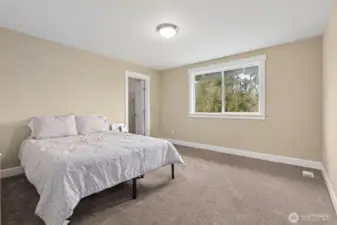 Bedroom #2 upstairs is bigger than expected and nicely balanced. The backyard facing window brings in light and a peaceful view, the carpeting keeps things cozy, and the muslin toned walls make it easy to layer in any style. The walk in closet is a real bonus, especially for a secondary bedroom, giving you storage without sacrificing floor space.