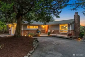 Lake Forest Park 5-bedroom home with wide driveway and updated exterior, ideally located near I-5, I-405, Hwy 522 and light rail access.