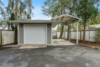 Garage with upgraded electrical, opener with fan and inflator, and additional outlets for convenience and future smart home integration.