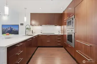 Quartz slab backsplash, Subzero fridge and Viking range