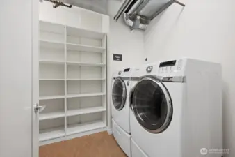 Separate Laundry room with storage space